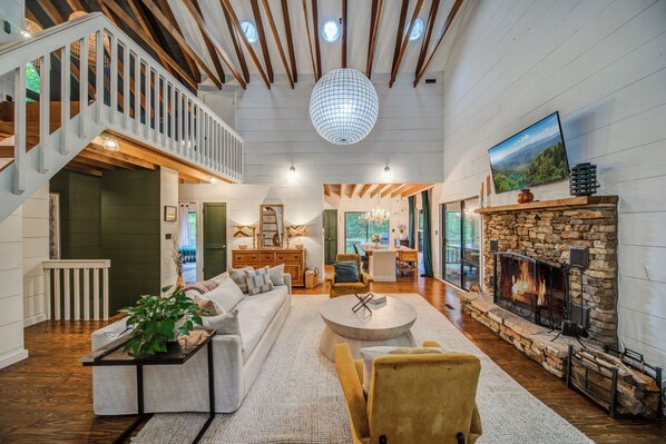 Come home and relax by the fireplace in the gorgeous living room
