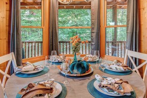 Gather for elegant meals together at the dining table, offering seating for 6