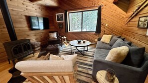 A-frame cottage nestled in the woods