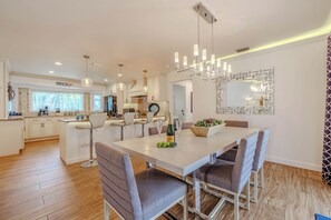 - Gather, dine, and make memories in this stunning open concept dining space
- Perfect blend of modern elegance and cozy charm, designed for unforgettable meals
- Enjoy seamless flow from the gourmet kitchen to the beautifully set dining table