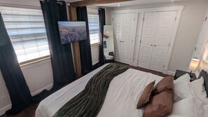 Comfy King Bed in the Primary with Smart TV and Black out curtains.