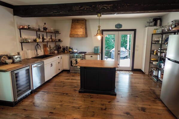Farmhouse Kitchen fully stocked with dishes and cookware. (1)