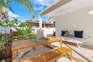 Dine alfresco or play some games with a table on the patio.