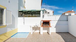 Unwind in this private outdoor space, complete with a BBQ and sink for the perfect outdoor cooking experience. #AlfrescoDining #BBQPatio