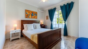 Another beautifully designed bedroom with plush bedding and natural light. #ComfortableStay #CharmingBedroom