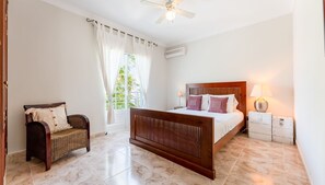 Bright and airy, this bedroom features a comfortable double bed and serene decor. #PeacefulRetreat #SunlitRoom