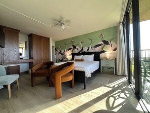 Main bedroom: king bed, TV, and sliding doors for extra privacy, lux bathroom 