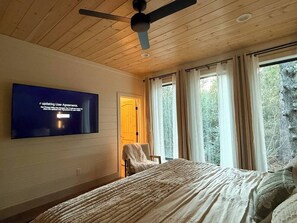 Large 65" TV for you to enjoy while you relax in bed.