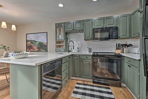 Kitchen with plenty of counter space to cook, eat, and sip! 