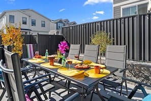 Relax and unwind on the fenced patio with ample outdoor seating, perfect for enjoying fresh air and good company