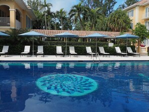 Plenty of tables, chairs and umbrellas at the pool and beachfront