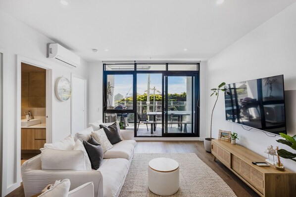 Super comfortable couches, laarge TV with streaming apps capability and balcony views