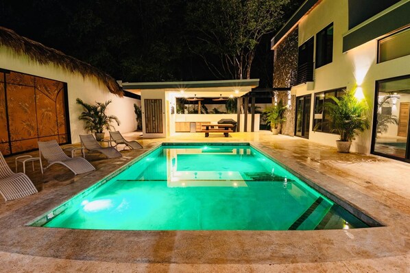 Large pool with deep section and kids section. Enjoy night swimming as well! 