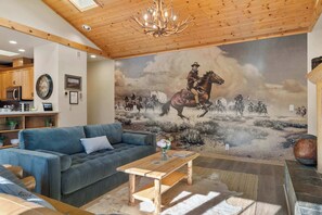 Check out the custom cowboy mural in our cozy living room—perfectly paired with a warm fireplace for true Western charm!