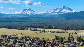 Nestled among the trees with breathtaking mountain views and a serene creek below—nature and downtown adventure await just steps away.