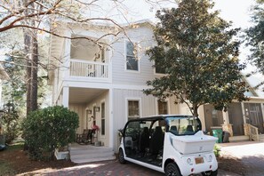 Step outside to the charming exterior of the home, complete with a convenient golf cart.