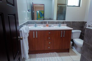 Well-appointed bathroom situated on the upper floor for added privacy.