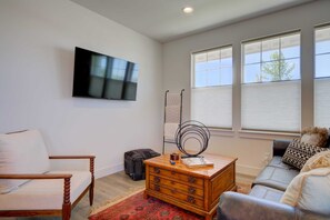 Living Room: Thoughtful placement of furniture and decor elements creates a balanced and aesthetically pleasing space.