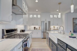 The kitchen features a large island that's the centerpiece for casual dining or entertaining.