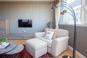 A relaxing armchair with a modern light
