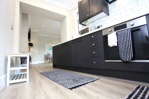 Modern kitchen fitted with ample items for guests