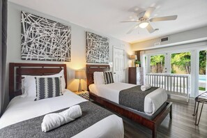 Bedroom 6 with 2 twin bed and a crib. Has direct access to the pool area