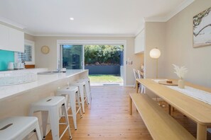 Enjoy slow mornings up at the breakfast bar or come together for a shared meal around the dining table.
