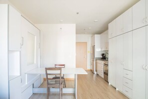 Murphy bed folded up into dining table/workspace