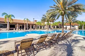 Relax by the luxurious resort-style pool with plenty of lounge chairs for soaking up the sun