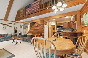 Dining table for 6-8 and stools at the bar area