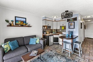 Spacious living room with plenty of natural light and comfort.