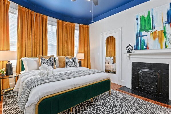Nestled at the heart of The Manor, the Hearth Room offers a cozy retreat with a king bed, extra pillows, a soft blanket, and a smart TV—everything you need to unwind in comfort.