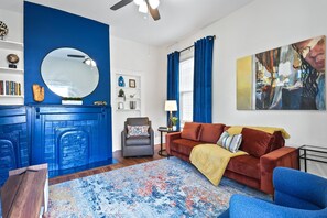 Bright, inviting, and perfect for relaxation!  The living room at The Victorian Manor offers comfortable seating for 5, seamless access to the kitchen and outdoor porch, and a smart Roku TV for cozy evenings in.
