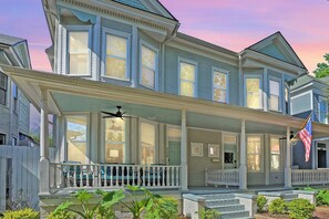 The Manor’s stunning Victorian exterior and charming front porch capture the timeless elegance of a bygone era, offering the perfect spot to relax and enjoy the historic surroundings.