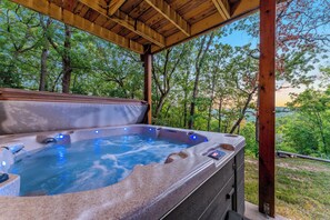 - Kick back in the bubbling hot tub while soaking in serene forest views and pastel skies
- Tucked beneath a timber roof, it's your year round cozy corner to unwind
- Whether it's sunrise or starlight, this is your go to spot for total relaxation