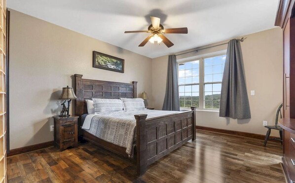 Master bedroom with a view! King sized bed with large armoire, TV stand, end tables with en-suite!