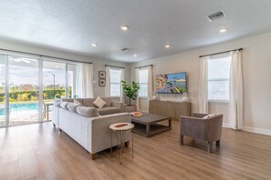 Bright and natural light filled Living room with access to the private pool