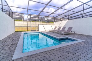 Private pool with loungers and safety fence