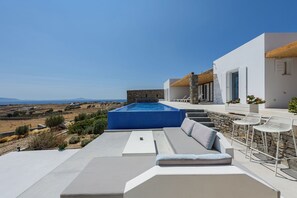 Bask in the Greek sun and unwind in luxury with scenic outdoor seating.