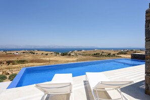 Reconnect with loved ones in this enchanting Cycladic villa.