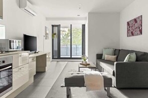 The living area with a sofa bed that folds out to a double.