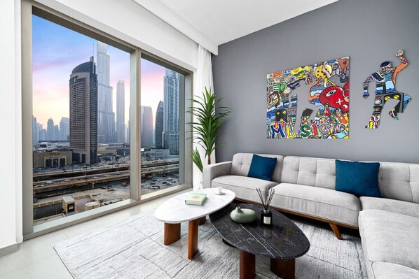 Enjoy stunning Burj Khalifa views from this art curated and comfortable living room