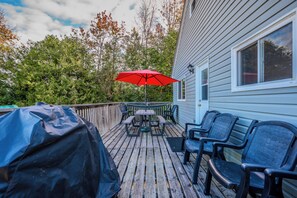 The deck includes ample seating, perfect for enjoying meals or unwinding in the fresh air.