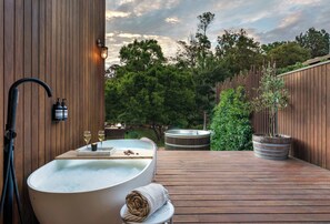 The master bedroom opens up to a beautiful outdoor bath and spa area.