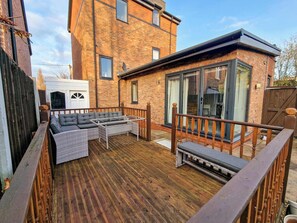 Relax and unwind on the outdoor furniture.
