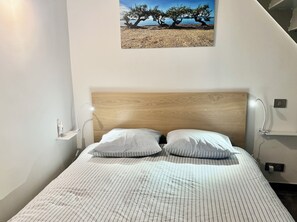 Bedroom 2, with double bed and dressing. Bed linen and towels are provided