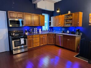 Full kitchen, apartment # 4 : blender, regular coffee, maker, can opener, toaster, microwave, silverware, cups, plates,etc