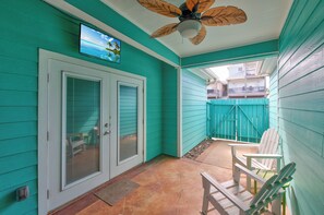 Exterior - Furnished Breezway with TV and ceiling fans for outdoor relaxation