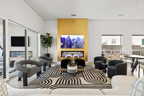 Bright living area with ample seating and Smart TV