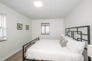 The first bedroom retreat boasts a regal king-sized bed